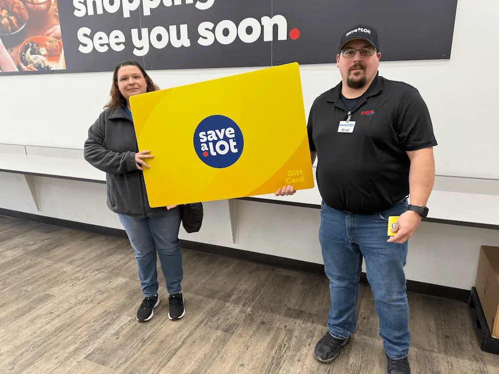 L to R: Angie Smith, winner, Store Owner Brad Witcher - Kewanne, IL