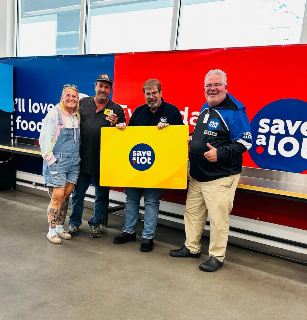 L to R: Pam Shae, Richard Shae, winner, Store Manager Fred Meyer, District Manager Keith Brosnan - North Port, FL