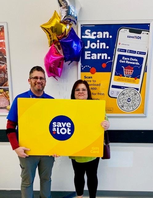 L to R: Jamey Fraley, Store Manager, Terrie Woods, winner - Summersville, WV
