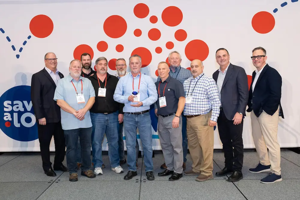 From left to right: Front row: Fred Boehler, Save A Lot CEO, Tim Freeman, Save A Lot Retail Partner, Jeff Pearson, Freeman Family Enterprises, Scott Reynolds, Manager of the Year, Paul Freeman, Save A Lot Retail Partner, Fred Phillips, Save A Lot Regional Director, Bill Mayo, Chief Operating Officer, Mark Kotcher, Senior Vice President of Sales and Operations Back row: Steven Freeman, Freeman Family Enterprises, Tom Freeman, Freeman Family Enterprises
