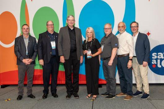 Kristin Hammond MOY from l to r: Bill Mayo, Save A Lot Chief Development Officer, Fred Boehler, Save A Lot CEO, Joey Hays, Save A Lot Retail Partner, Kristin Hammond, Manager of the Year, Kevin Nolen, Save A Lot Area Business Consultant, Kelly Lemos, Save A Lot Regional Director and Mark Kotcher, Save A Lot SVP of Sales