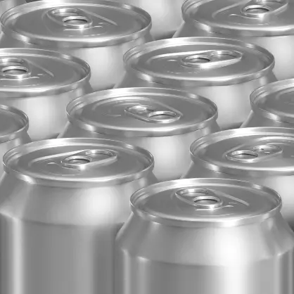 A large cluster of shiny, unbranded silver aluminum beverage cans viewed from above.