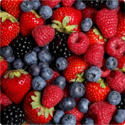 Mixed berries closeup, including strawberries, blackberries, raspberries, and blueberries