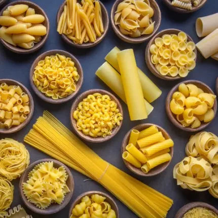 A variety of pasta types spread across a table