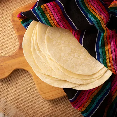 Flour tortillas presented on a cutting board
