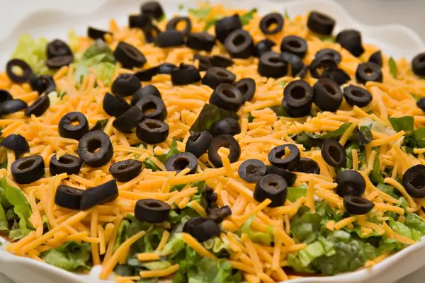 Layered fiesta dip recipe using Señora Verde® refried beans
