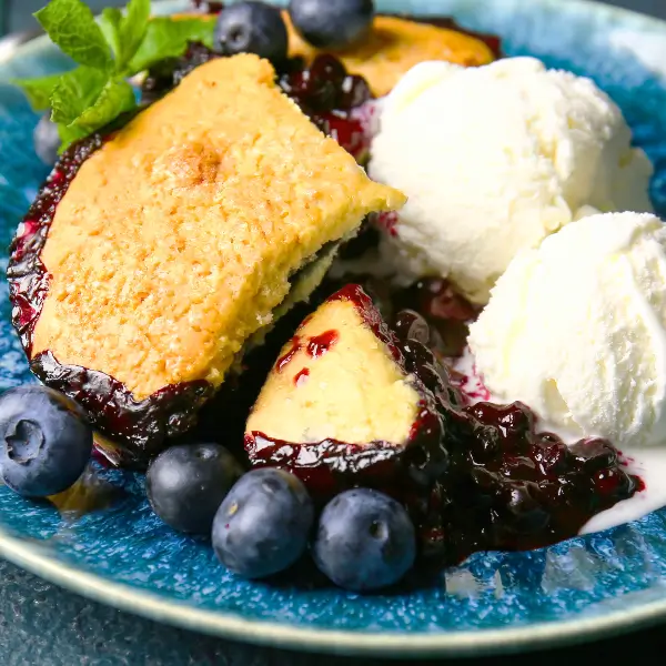 Blueberry Lemon Cobbler with scoops of Crown Creamery Vanilla Ice Cream on the side